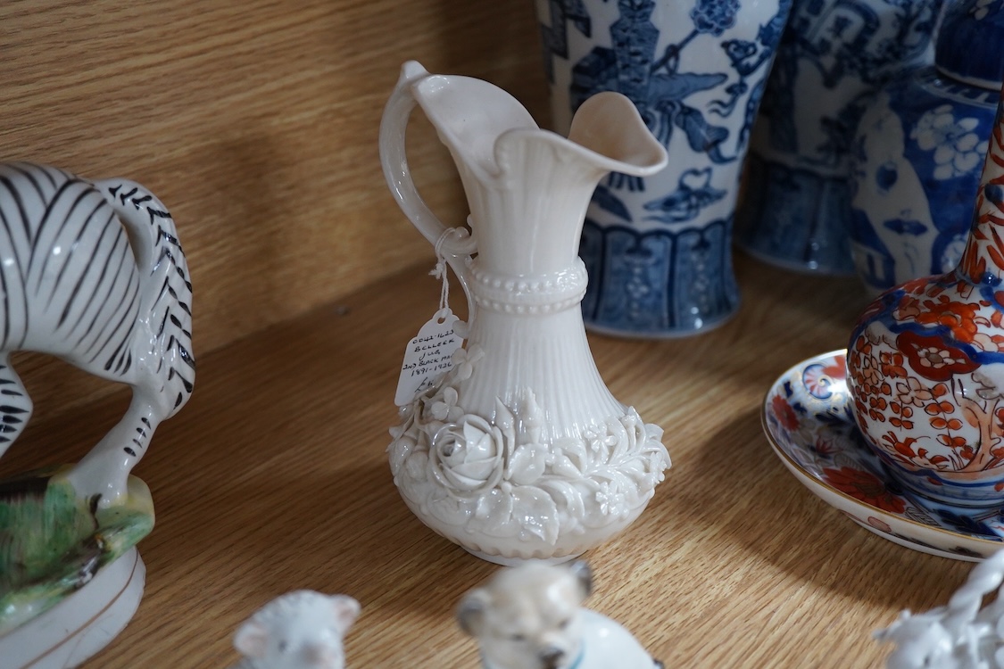 A pair of Worcester 'owl' candle snuffers, Staffordshire Zebra and two sheep, Belleek etc zebra 19cm wide.